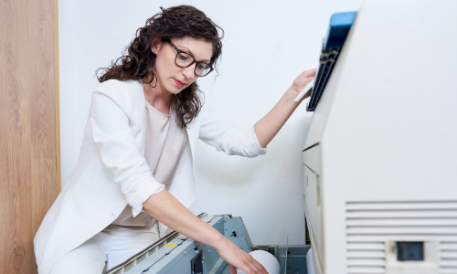 Loading office paper into a printer