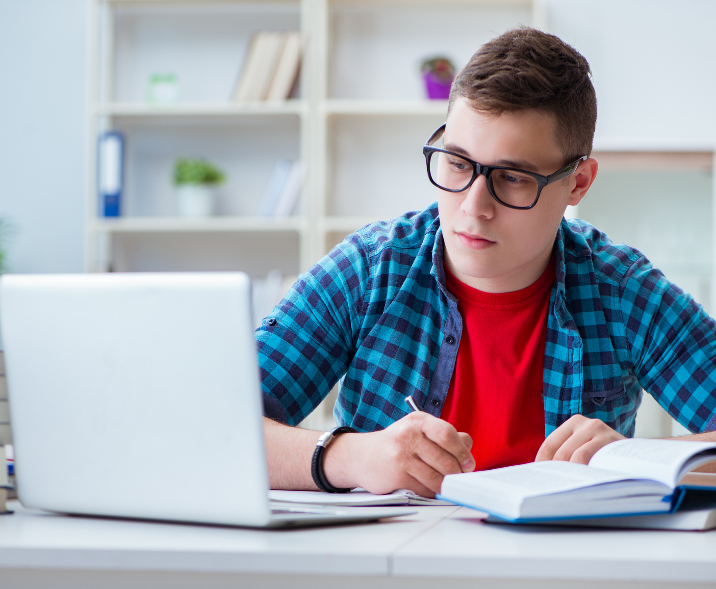 Kid sitting in front of laptop