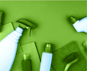 Cleaning products on green background