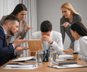 Coworkers bullying their Colleague at Workplace in Office